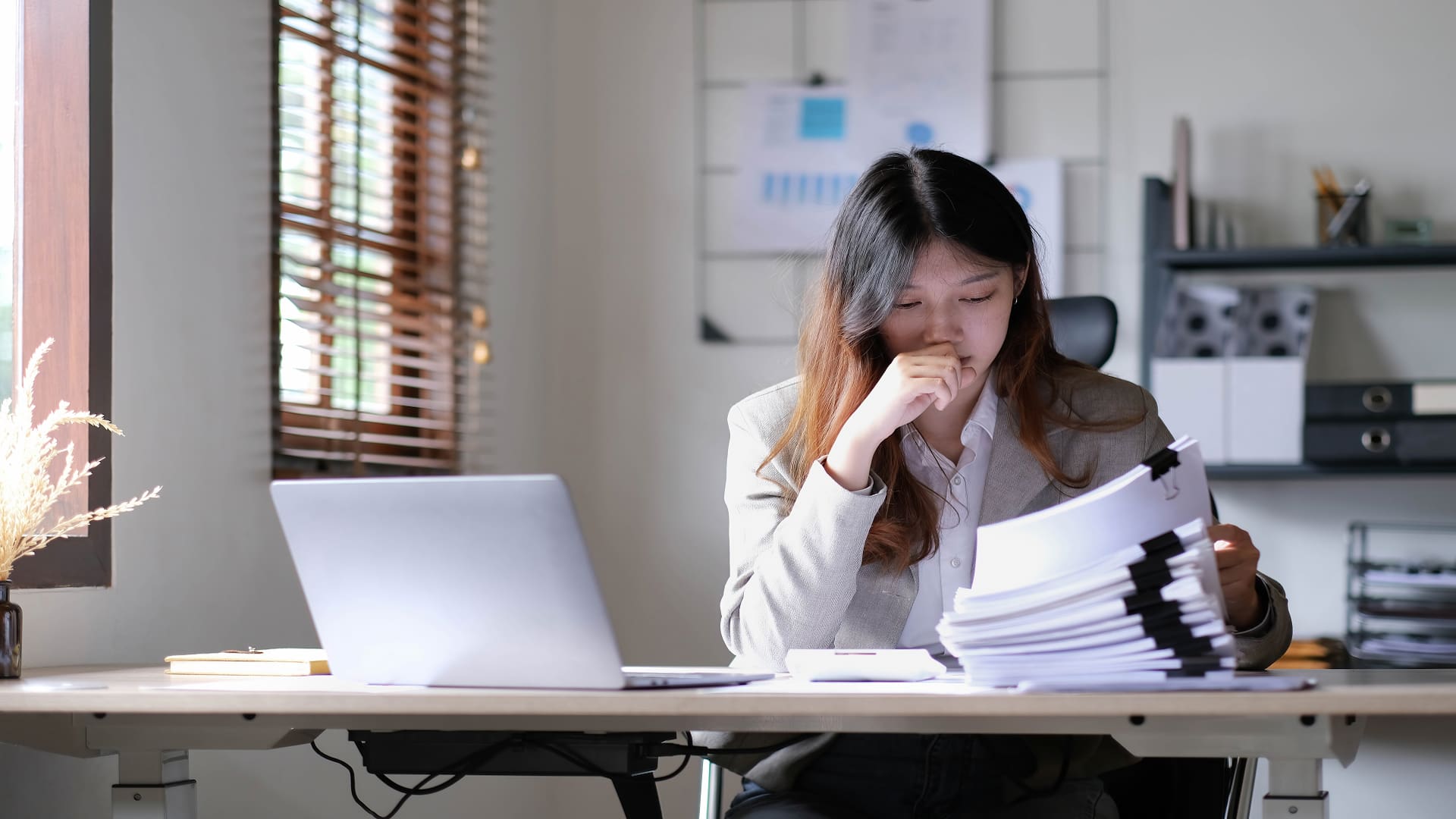 thoughtful-asian-businesswoman